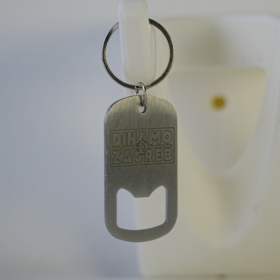 Metal keychain with bottle opener and 'Dinamo Zagreb' branding on a white background